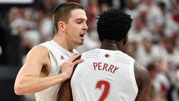 No. 1 Louisville tops No. 4 Michigan from start to finish to stay perfect