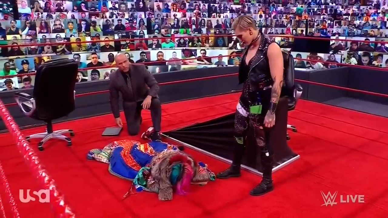 Asuka takes a table to the face at contract signing with Rhea Ripley