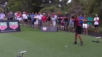 Olympic gold medalist snowboarder hits tee shot… right into a poor cameraman