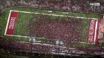 Washington State fans rush the field and carry their QB to glory after knocking off No. 12 Oregon