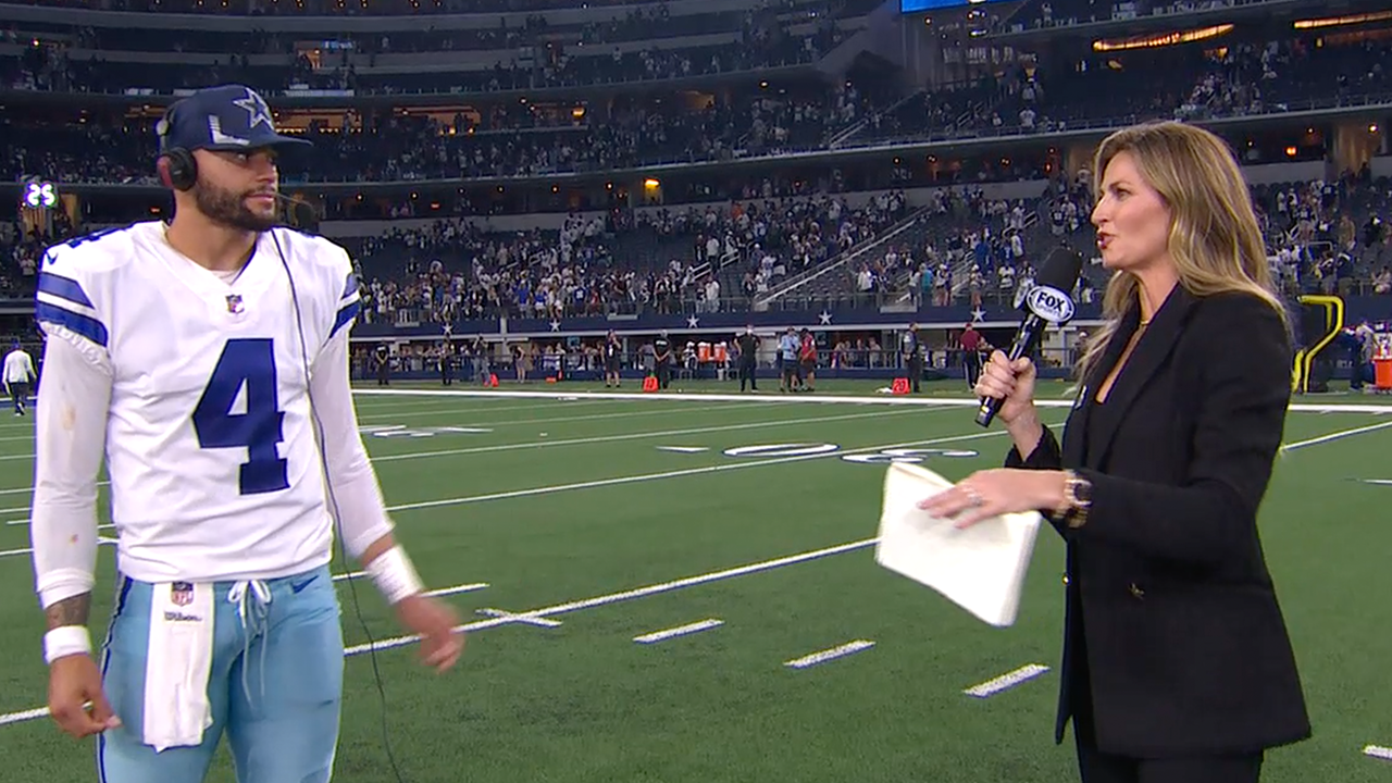 Dallas Cowboys quarterback Dak Prescott hugs Erin Andrews before