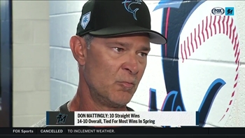 Paul Severino catches up with manager Don Mattingly during spring training