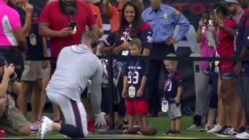 JJ Watt plays catch with fans around the stadium pregame